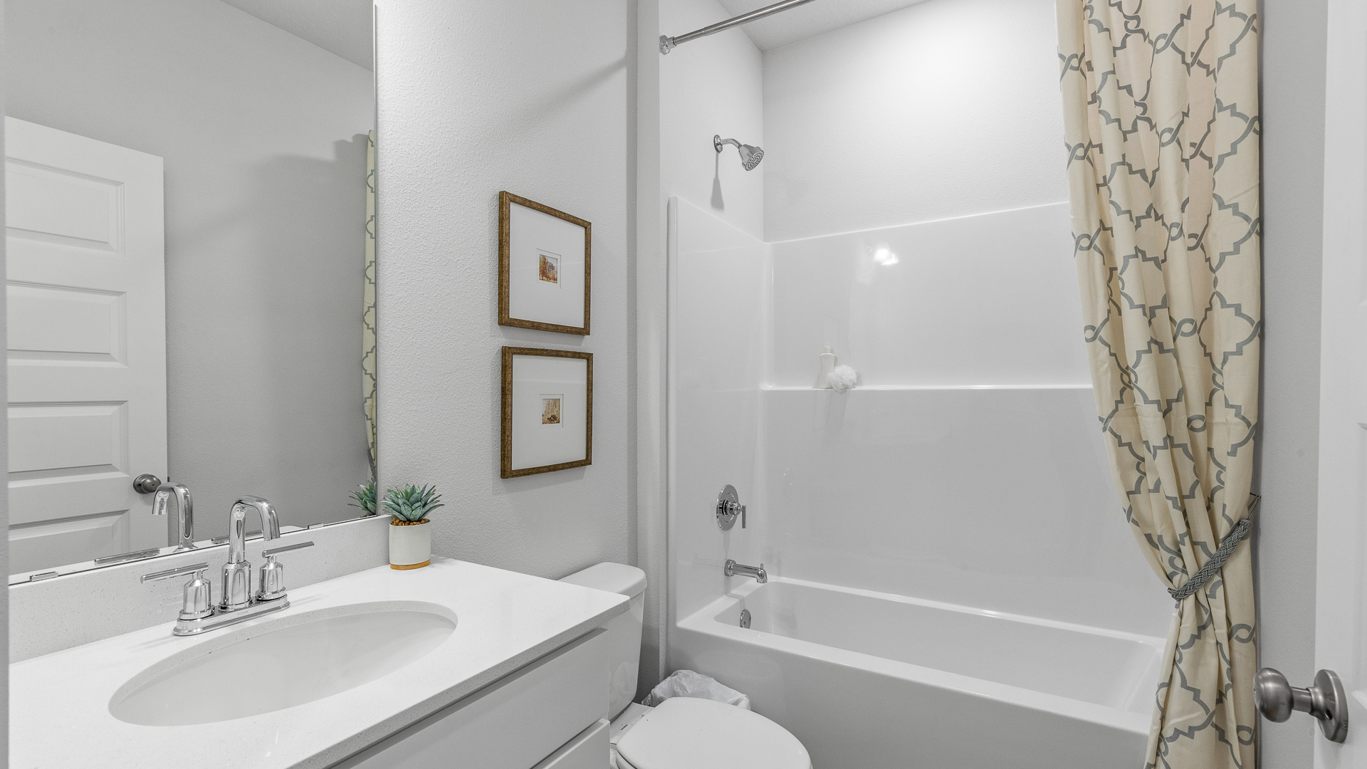 The Camilla Floorplan guest bathroom with shower tub combo