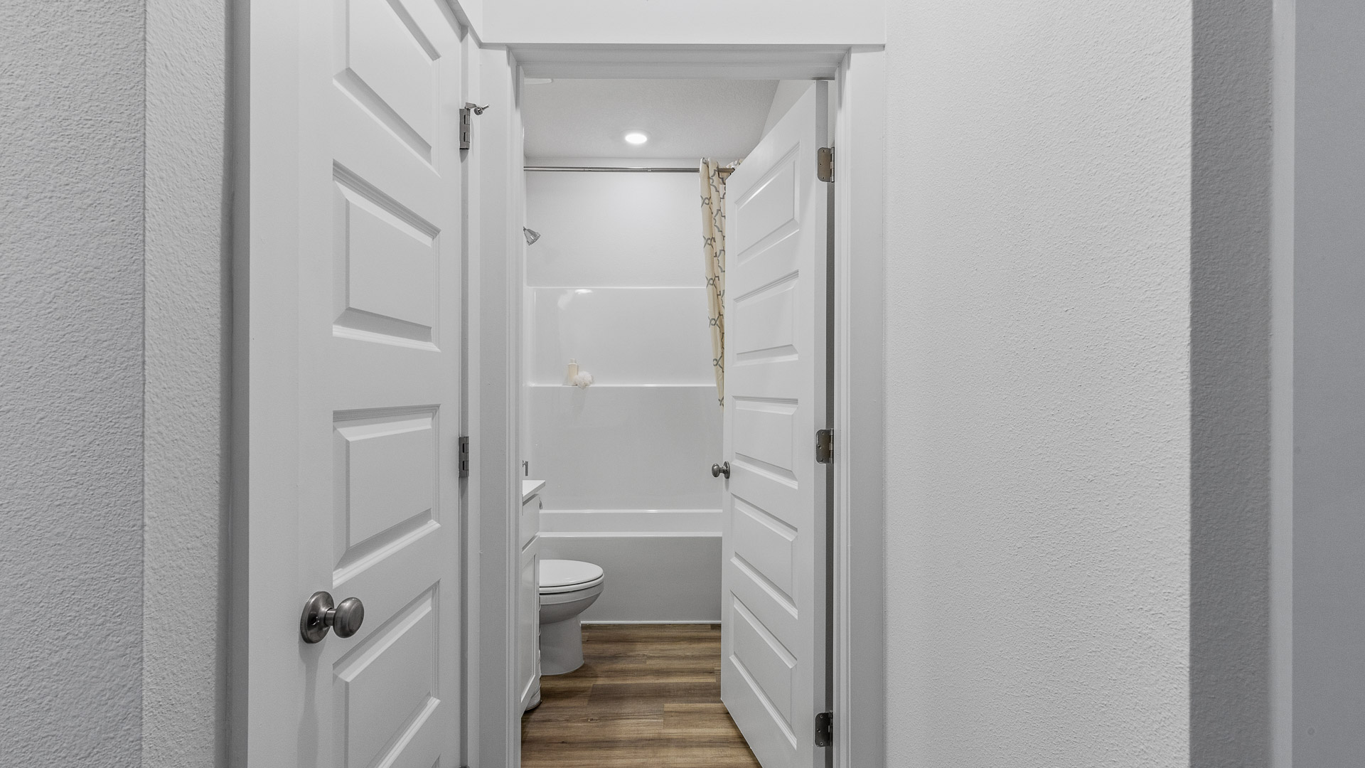 The Camilla Floorplan guest bathroom with EVP throughout