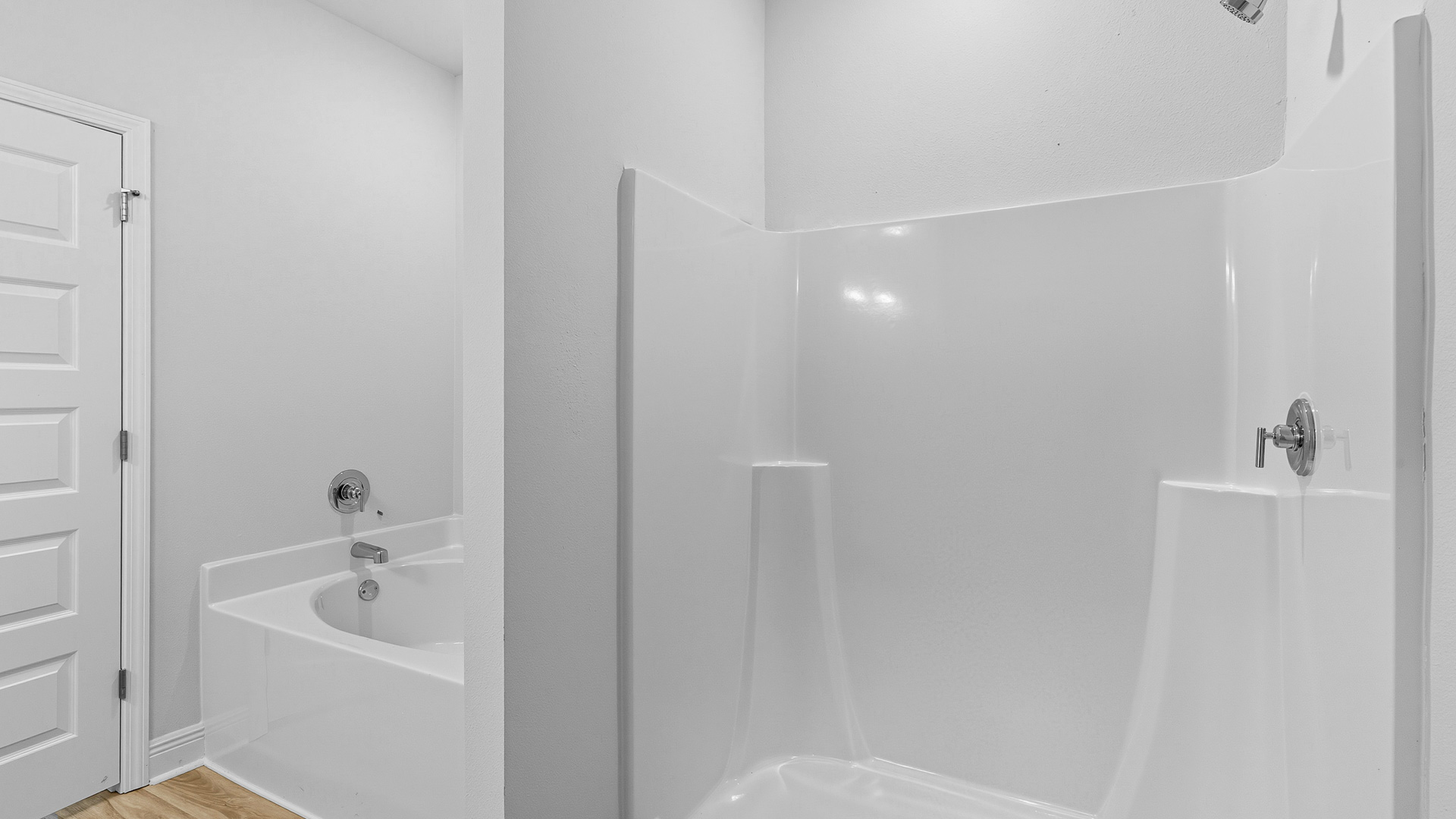 The Creekside floorplan primary bathroom with shower and soaking tub