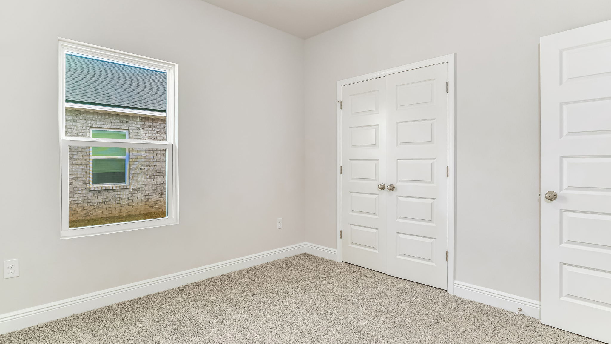 The Delilah guest bedroom one with carpet throughout