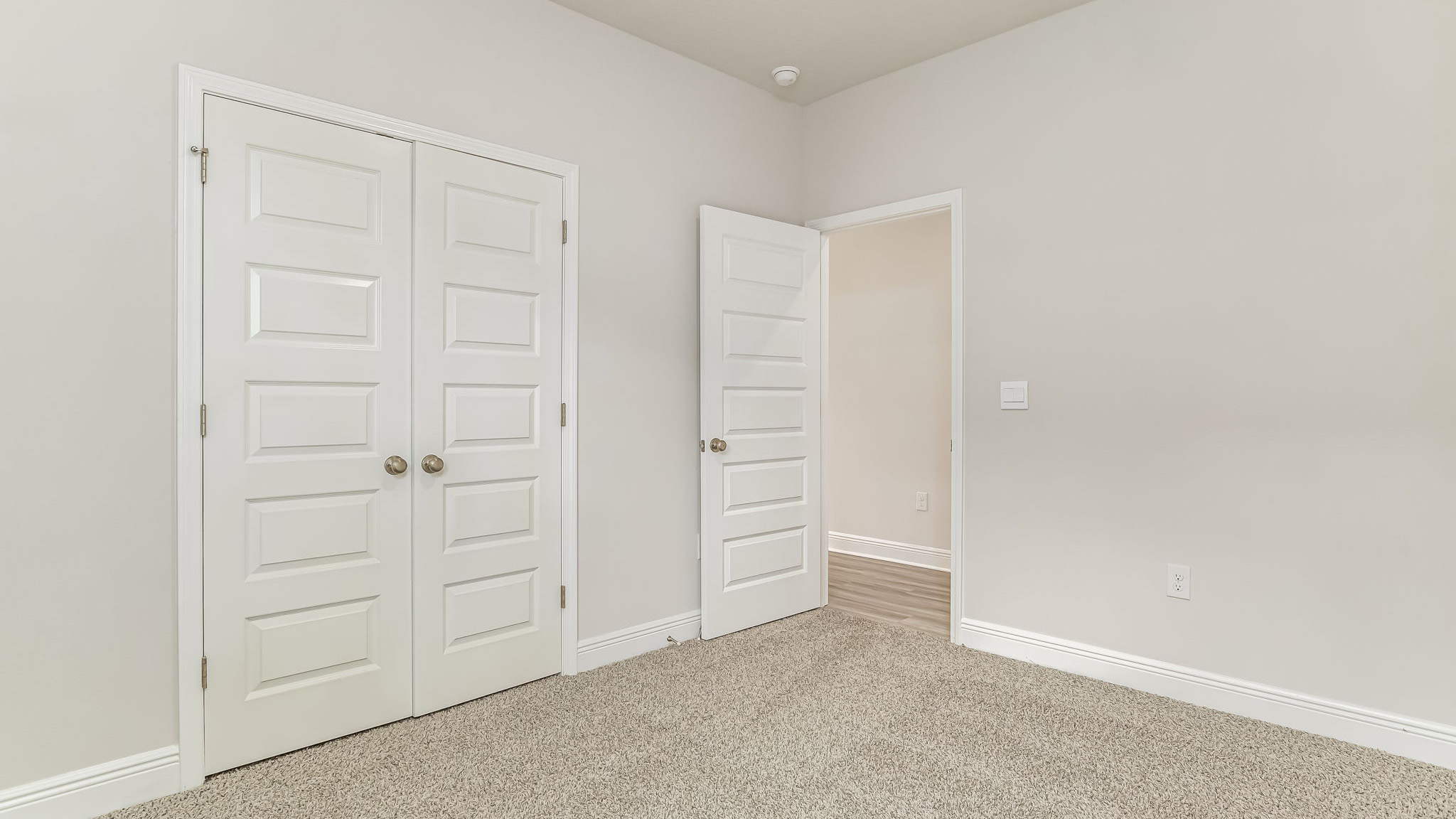 The Delilah guest bedroom one with carpet throughout