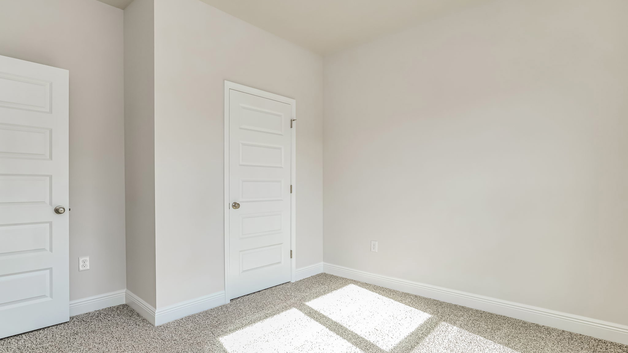 The Delilah guest bedroom two with carpet throughout