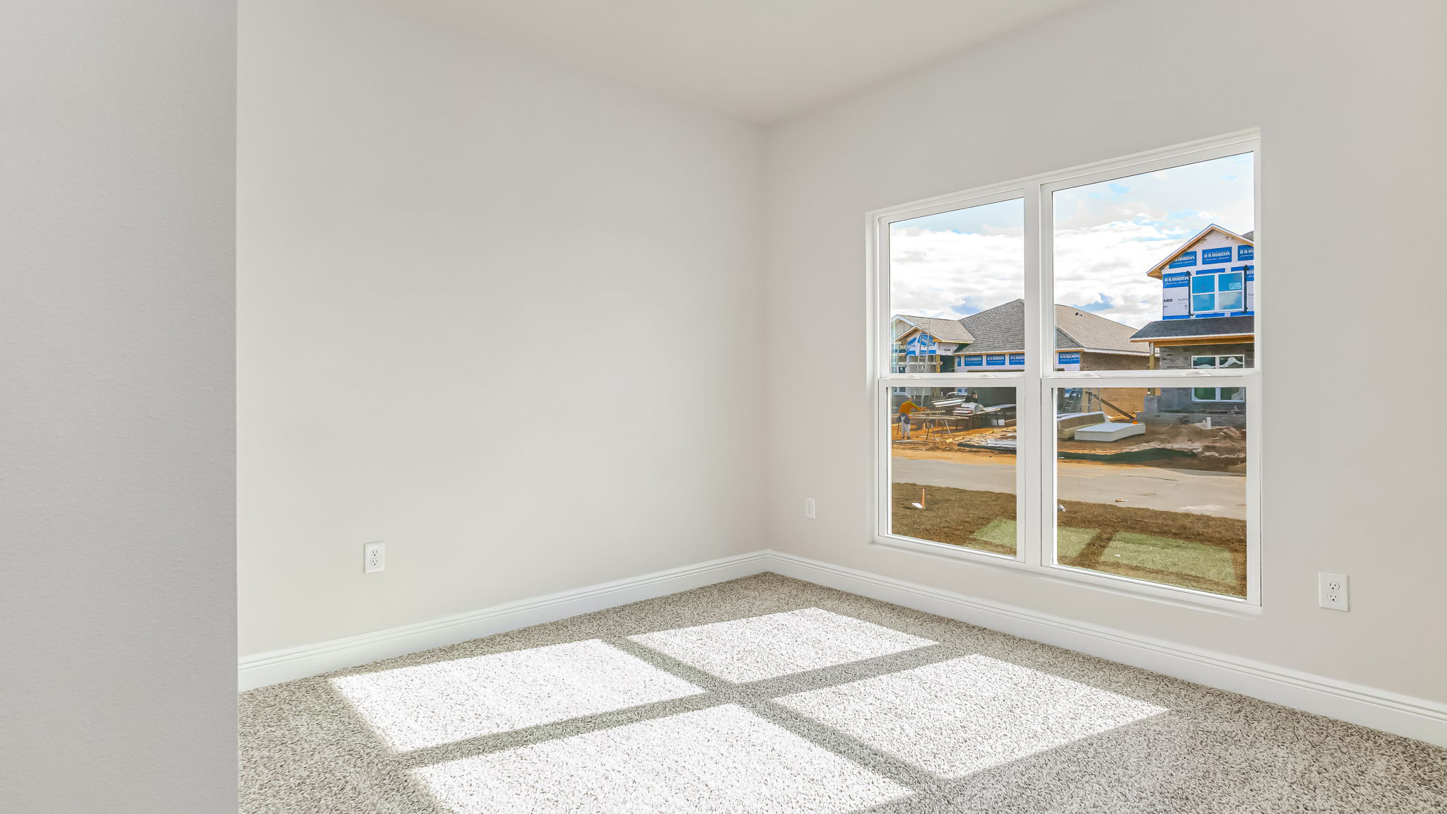 The Delilah guest bedroom two with carpet throughout