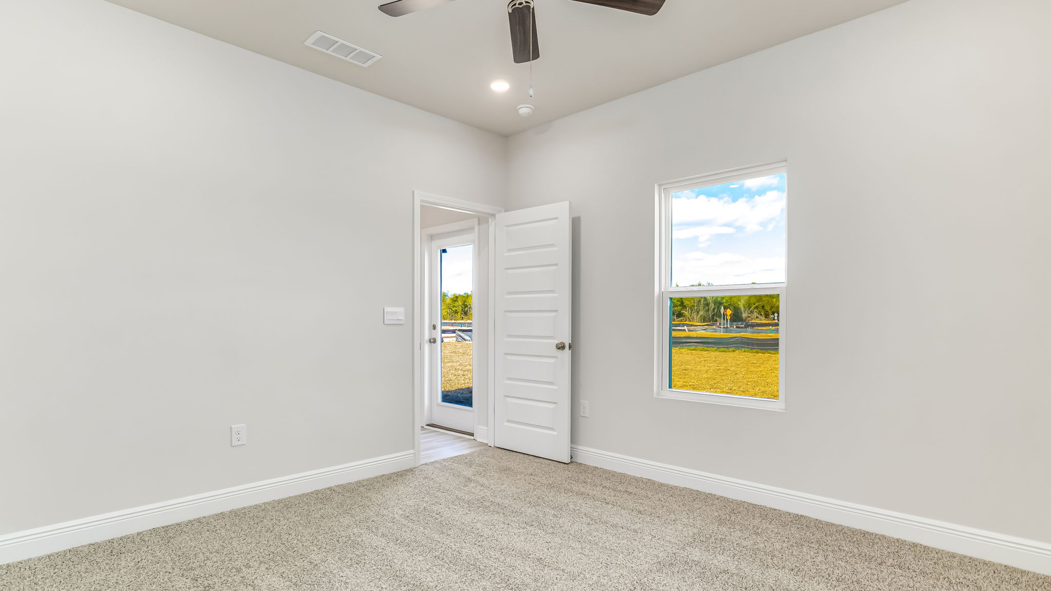 The Delilah open concept living and dining room with EVP flooring throughout