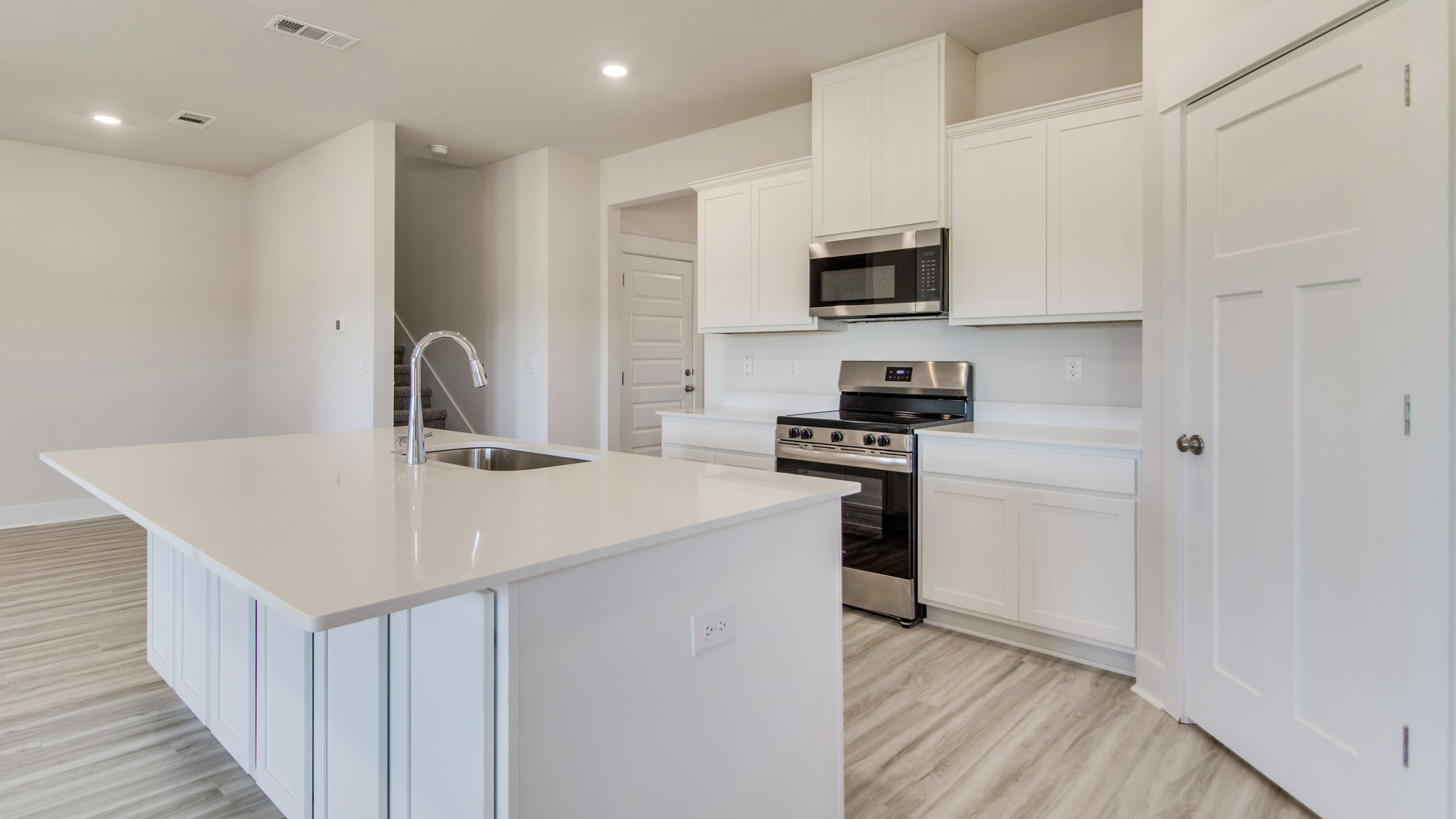 The Ozark floorplan kitchen island with quartz countertops
