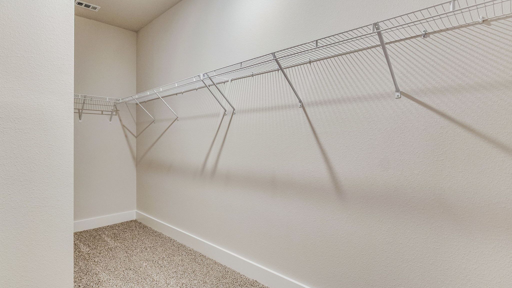 The Riverside floorplan primary closet with wire shelving
