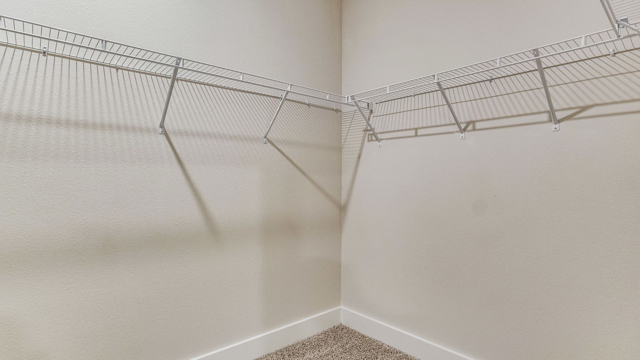 The Riverside floorplan primary closet with wire shelving