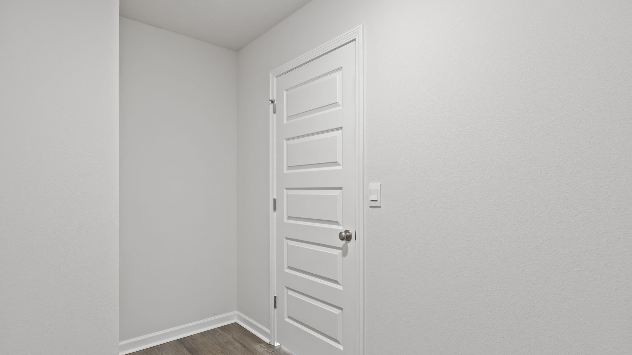 The Walker Floorplan laundry room with EVP flooring throughout
