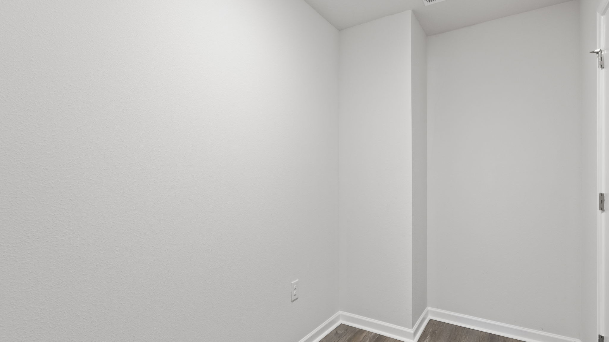 The Walker Floorplan laundry room with EVP flooring throughout