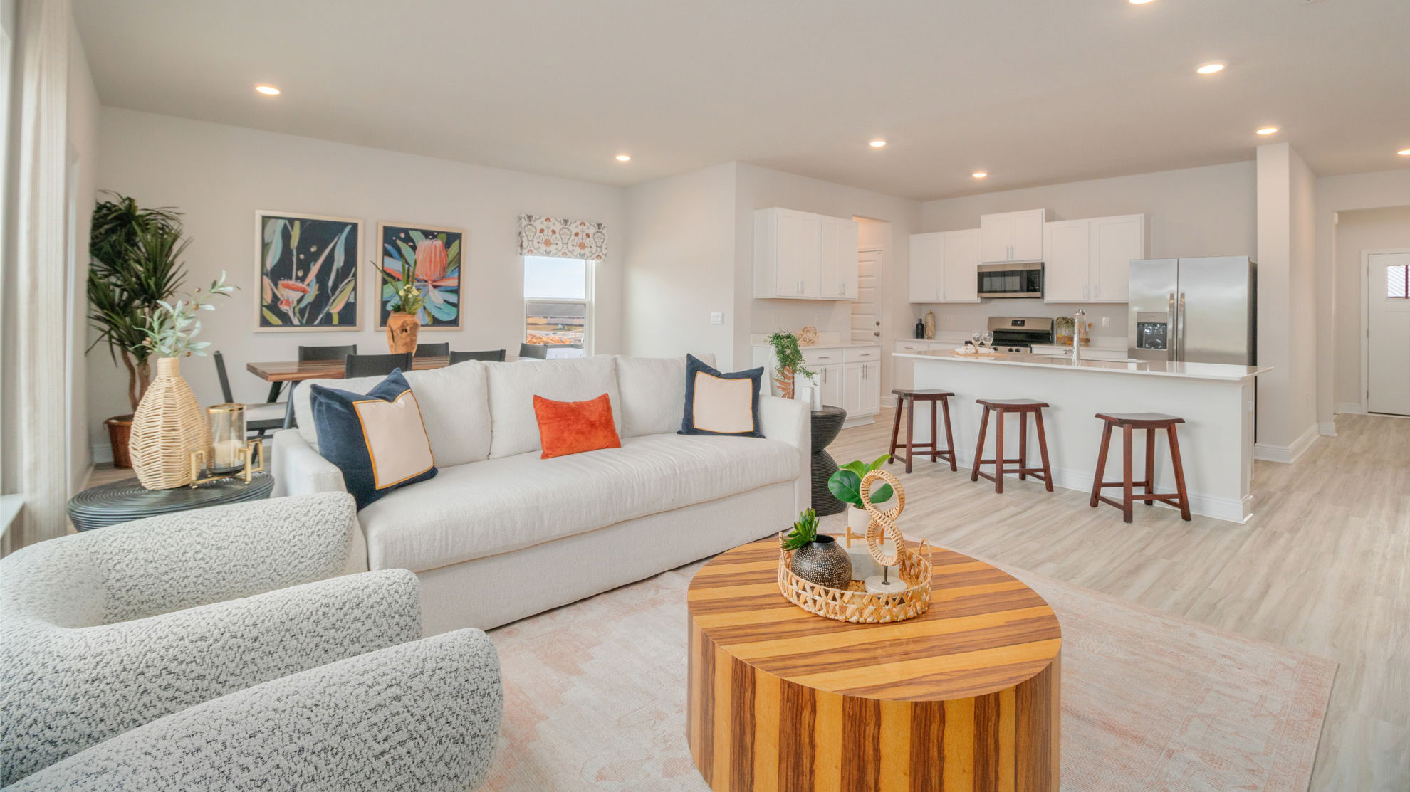 The Belfort floorplan main living space including the kitchen, dining room and living room