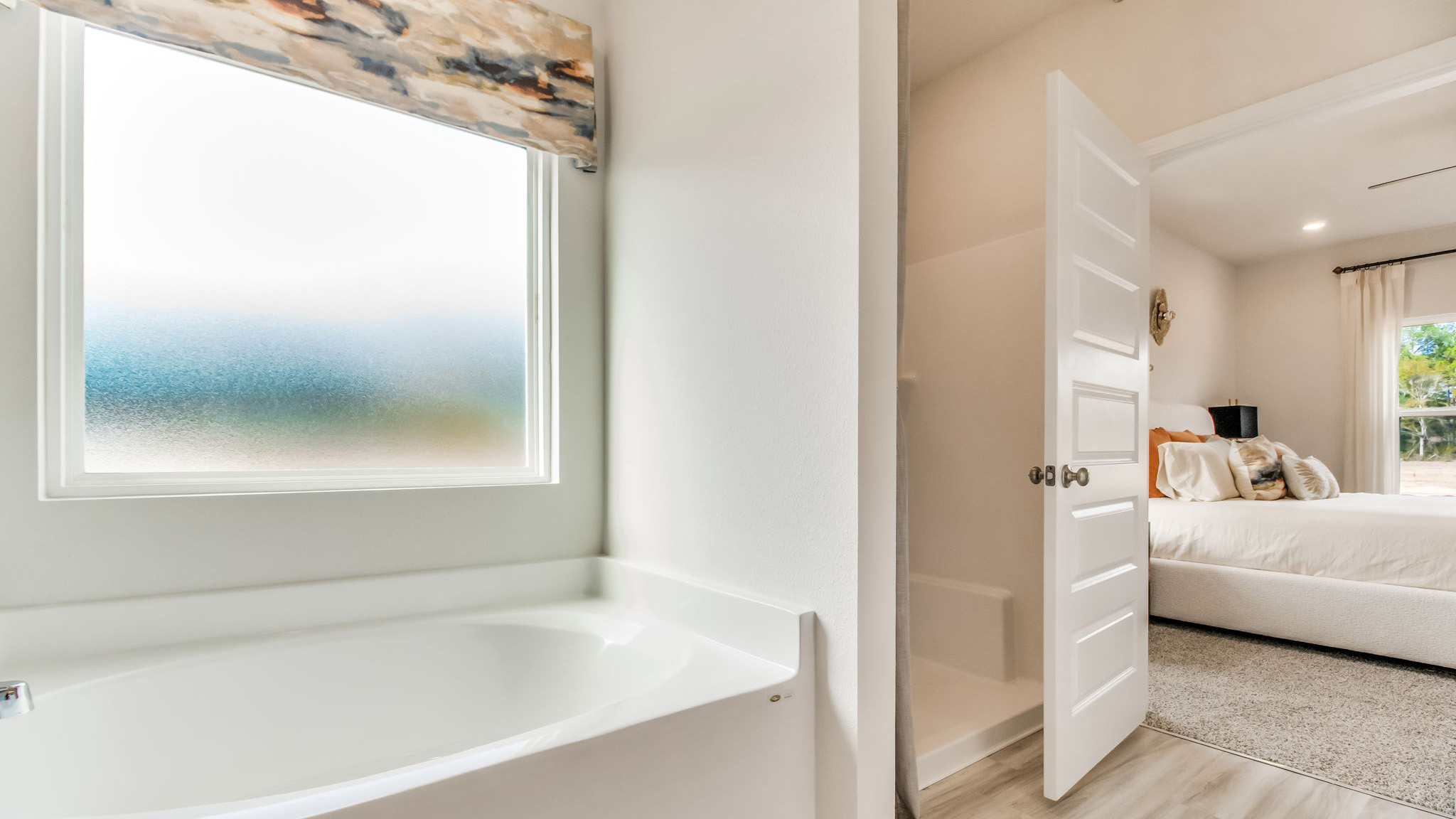 The Belfort floorplan primary bathroom with separate shower and soaking tub