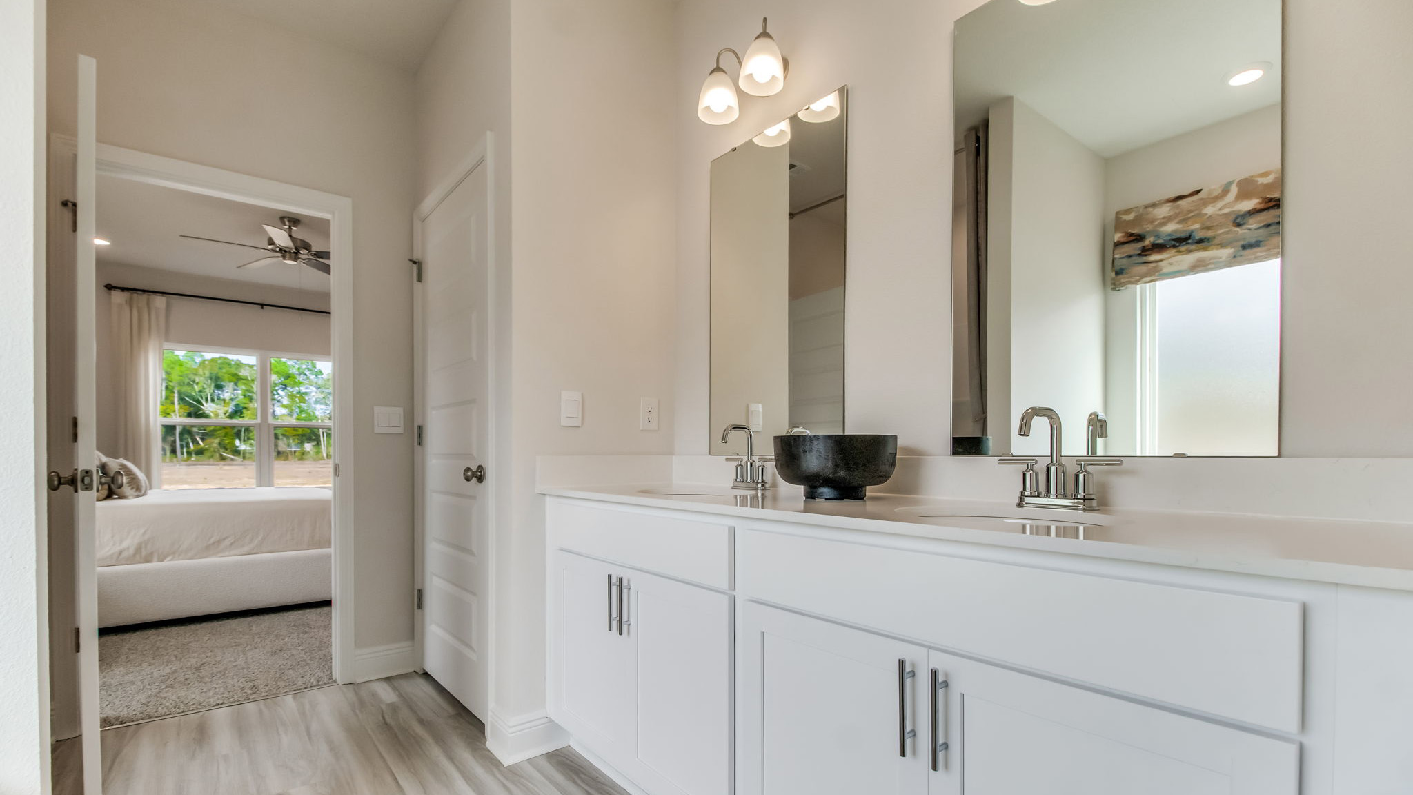 The Belfort floorplan primary bathroom with dual sinks and Quartz countertops