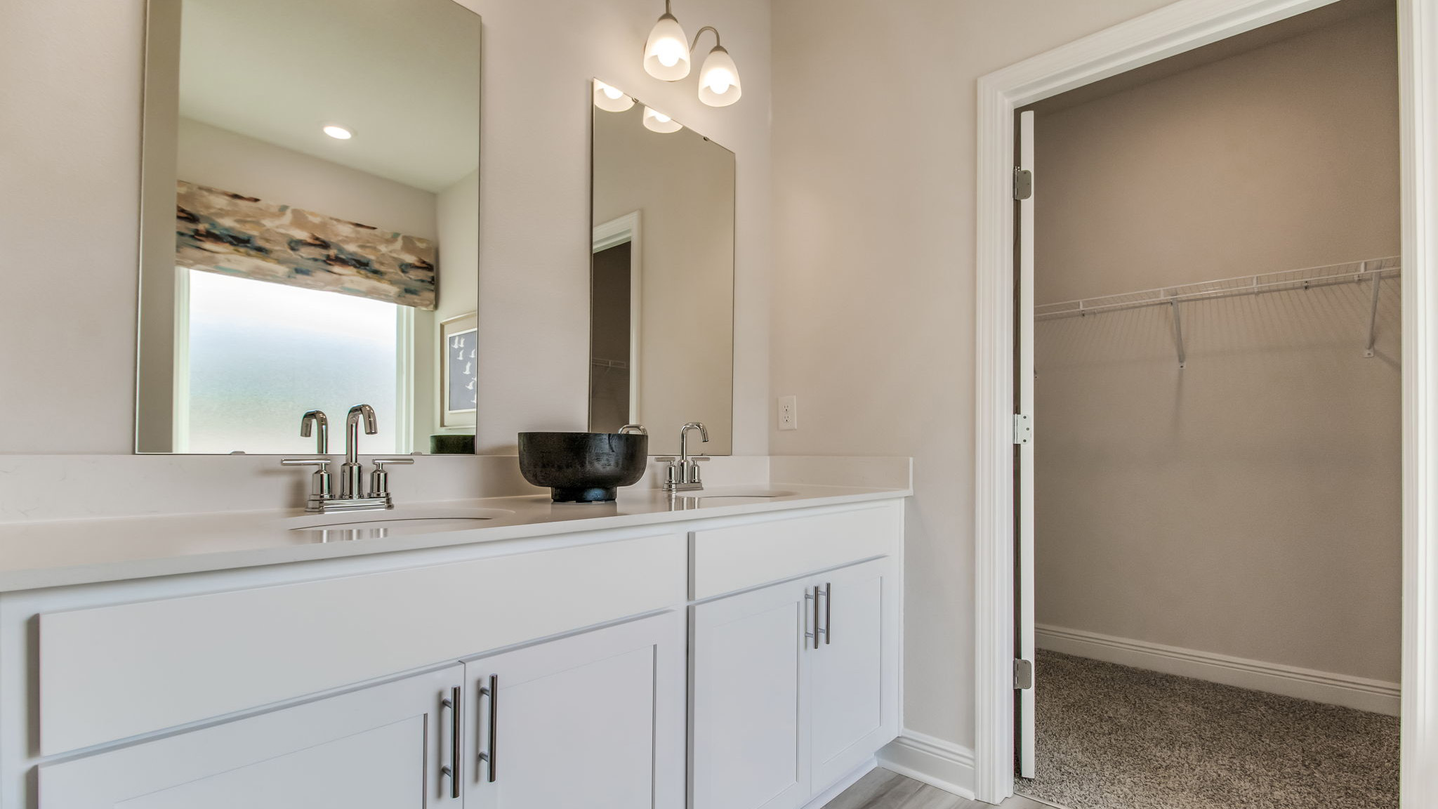 The Belfort floorplan primary bathroom with dual sinks and Quartz countertops
