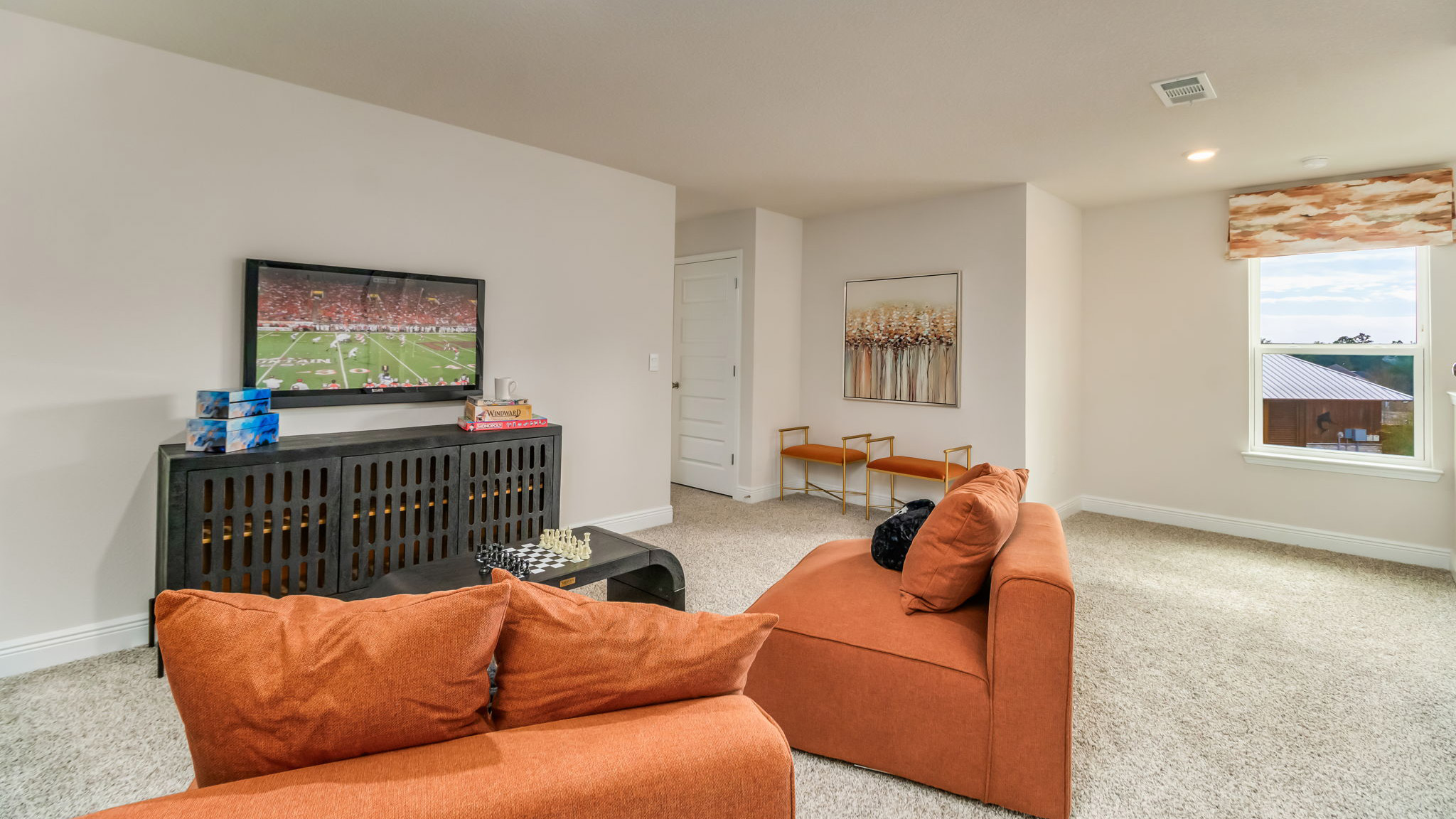 The Belfort floorplan bonus space with carpet throughout