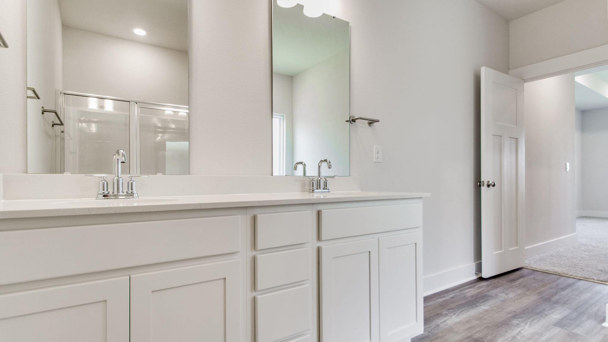 The Lamar floorplan primary bathroom with dual vanity and quartz countertops