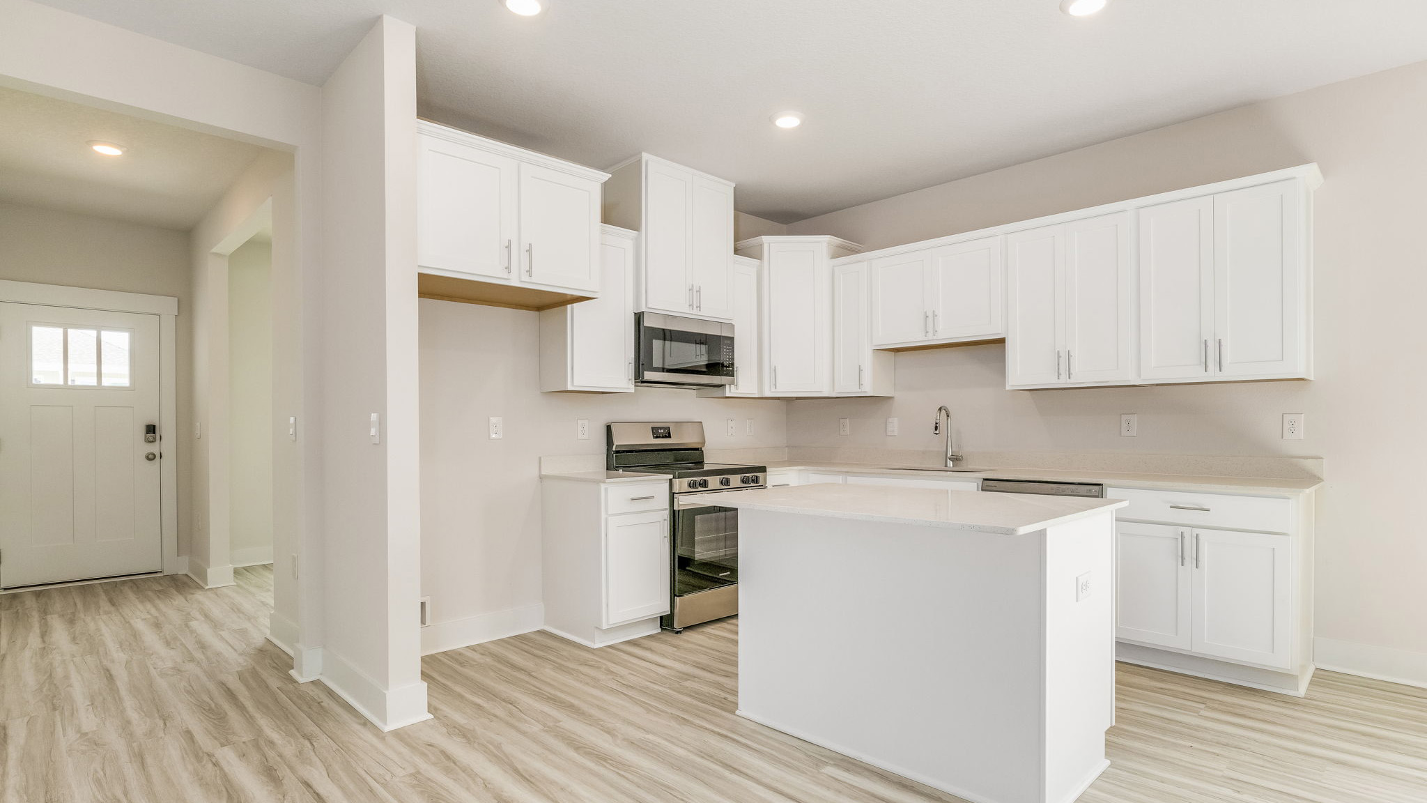 The Oakley floorplan kitchen with white shaker style cabinets
