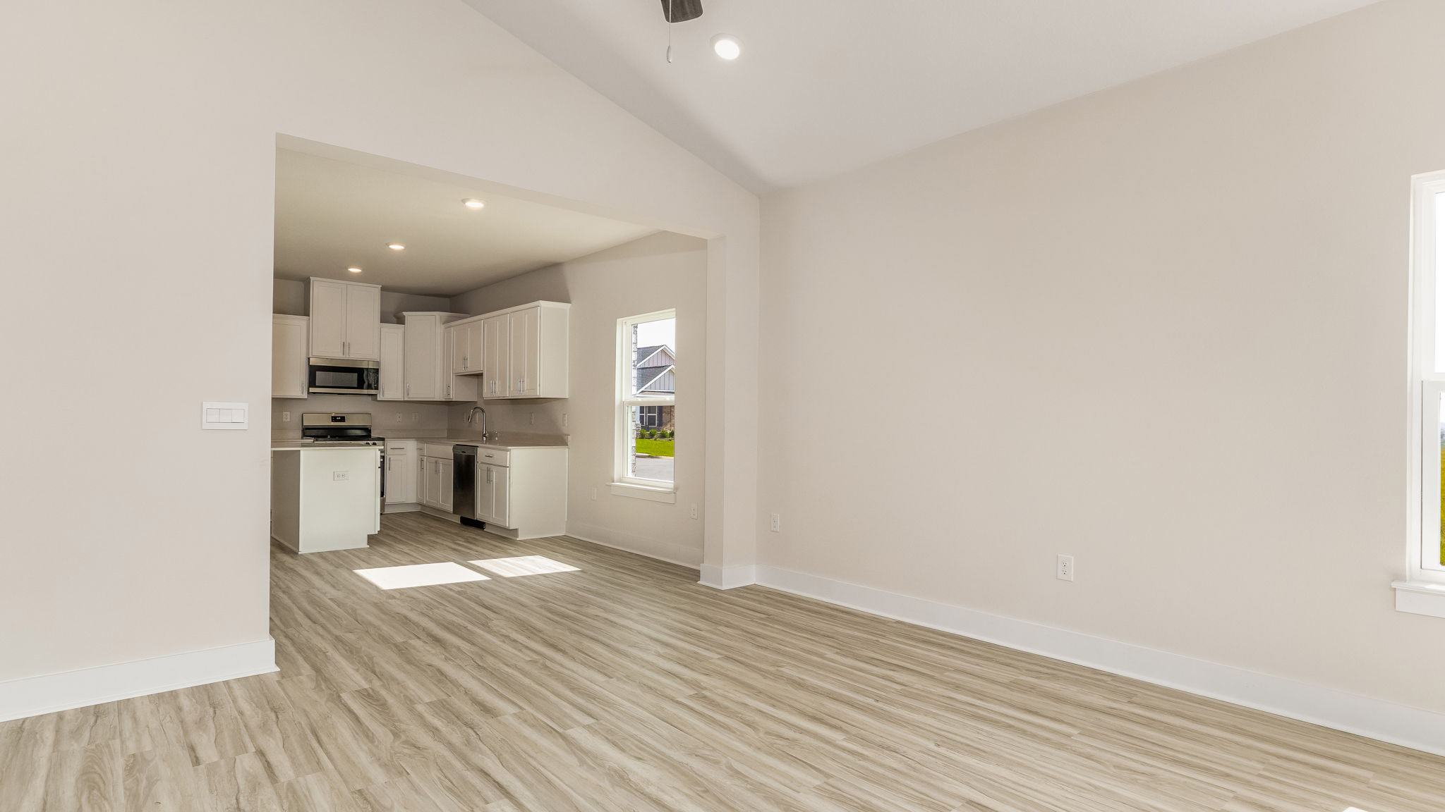 The Oakley floorplan living room with LVP flooring throughout
