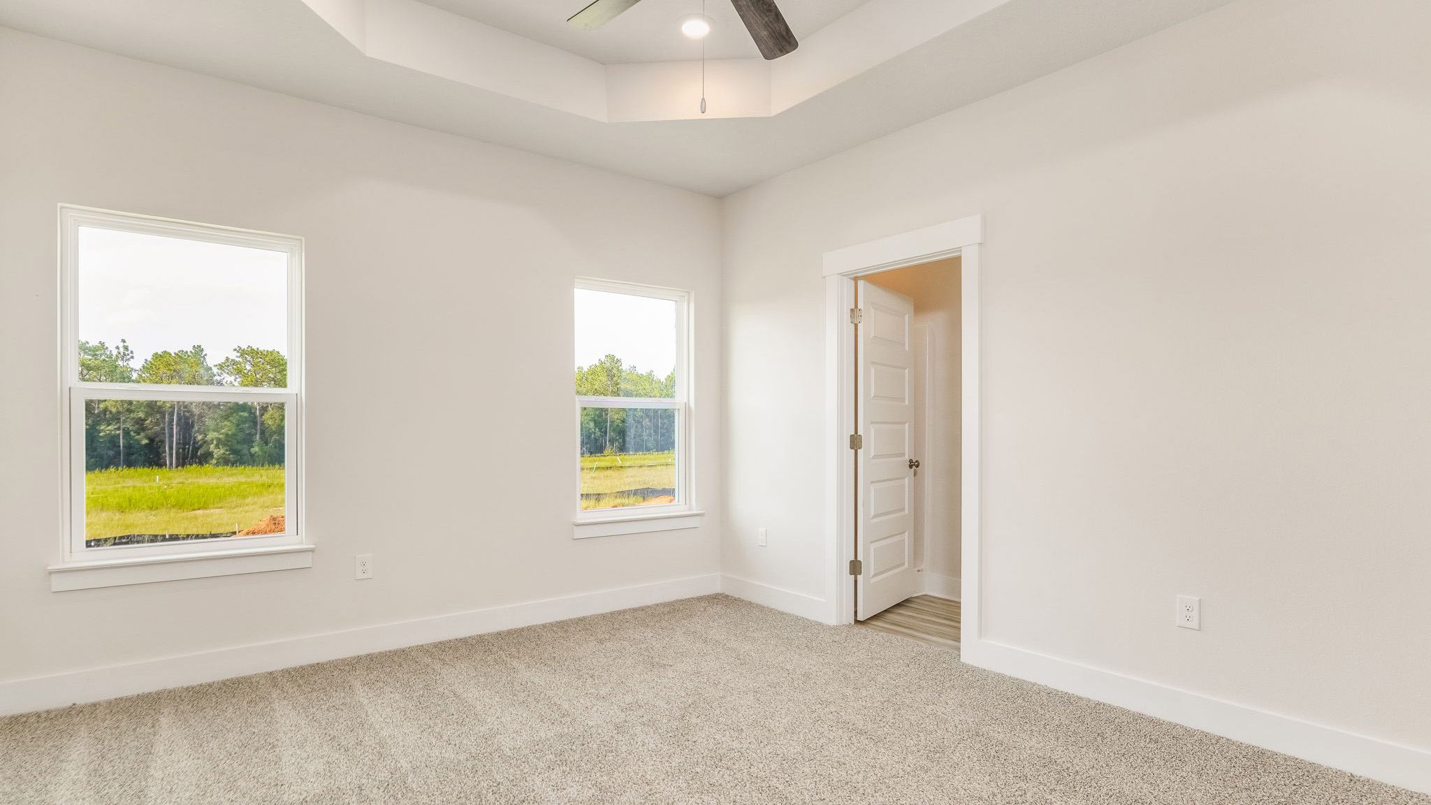 The Oakley floorplan primary bedroom with trey ceilings