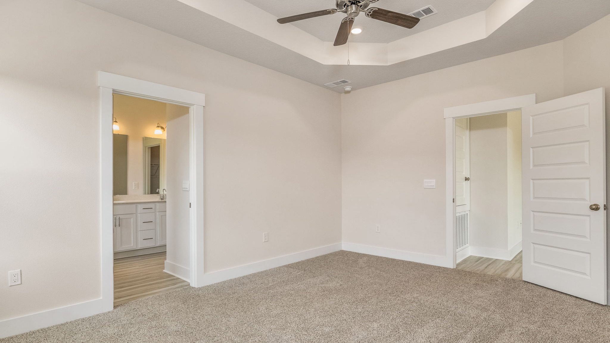 The Oakley floorplan primary bedroom with trey ceilings