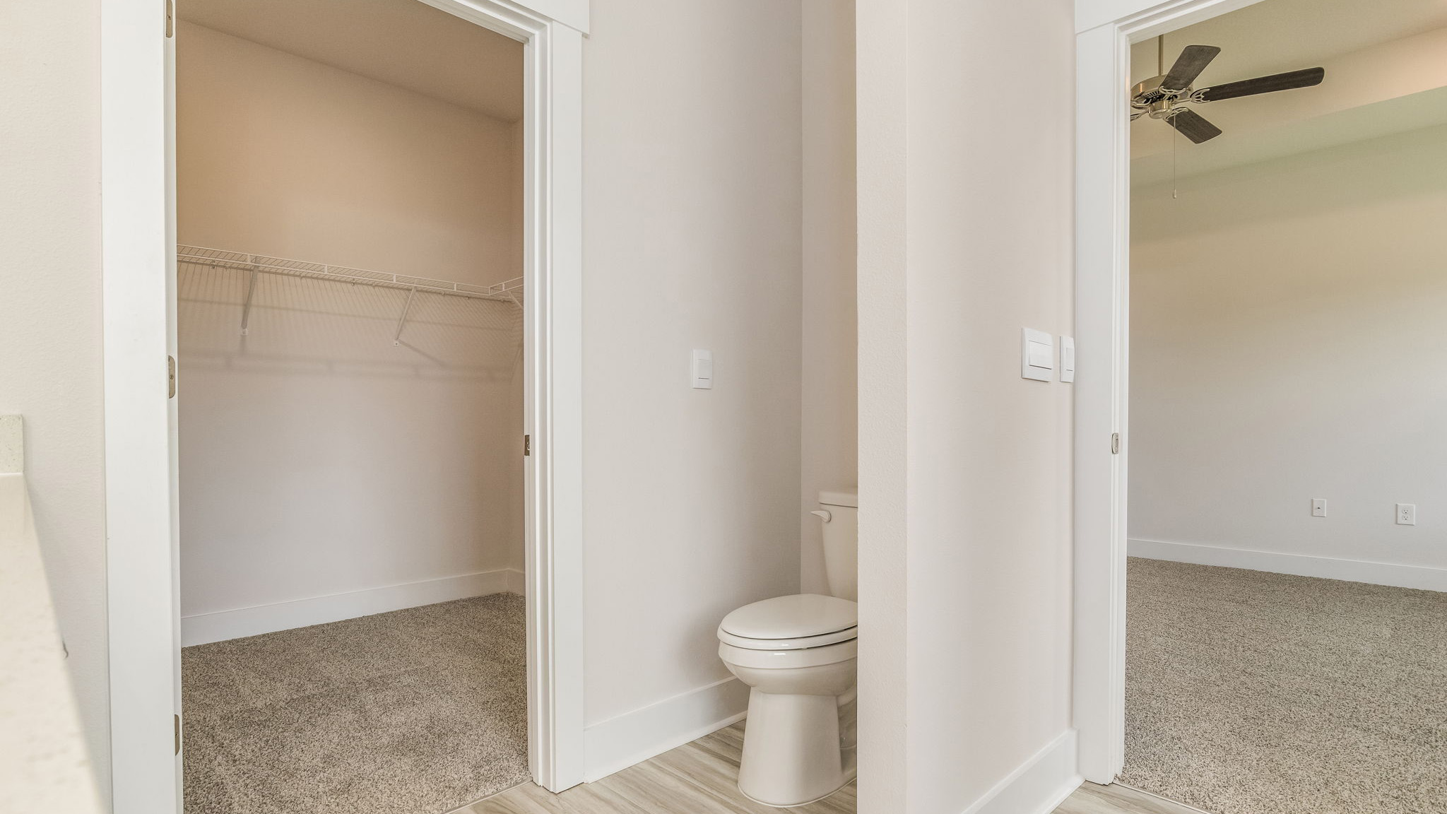 The Oakley floorplan primary bathroom with LVP flooring throughout