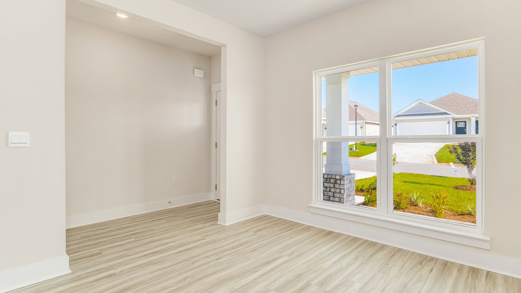 The Oakley floorplan study or bonus room at the entrance of the home
