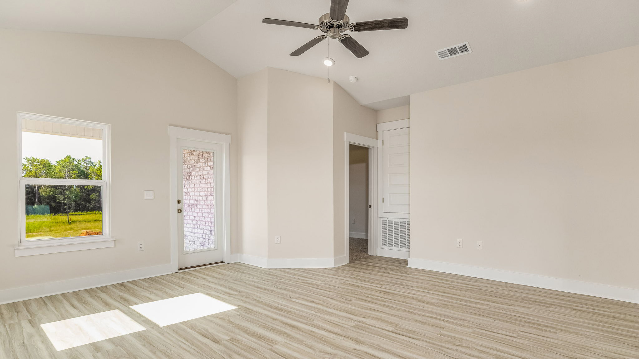 The Oakley floorplan living room with LVP flooring throughout