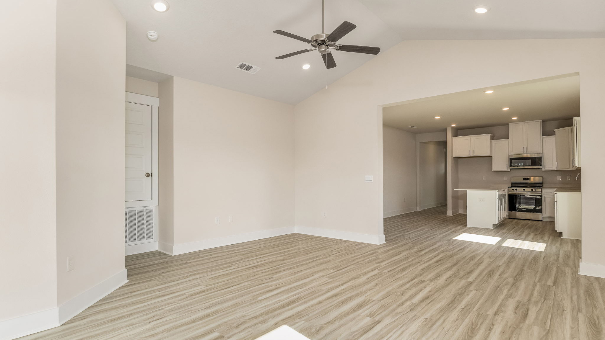 The Oakley floorplan living room with LVP flooring throughout