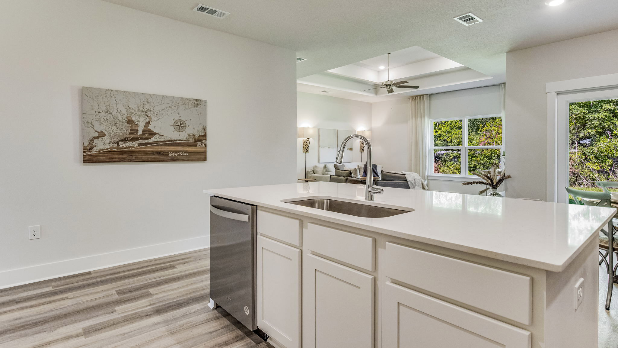 The Rhett floorplan kitchen island with quartz countertops and stainless-steel dishwasher