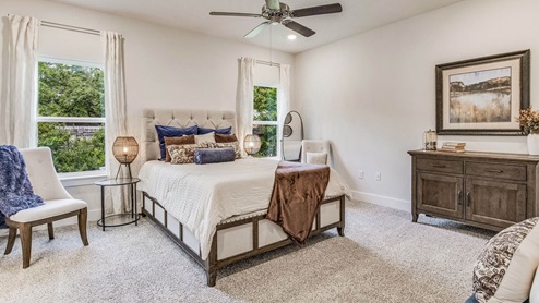 The Riverside floorplan primary bedroom with two windows