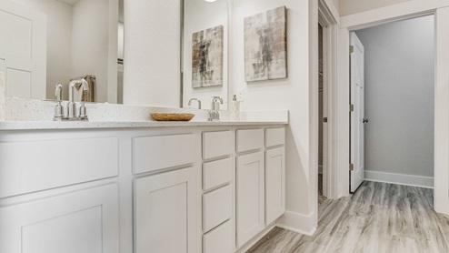 The Riverside floorplan primary bathroom with a dual vanity and quartz countertops