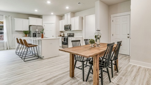 The Riverside floorplan dining room and kitchen with nine-foot ceilings