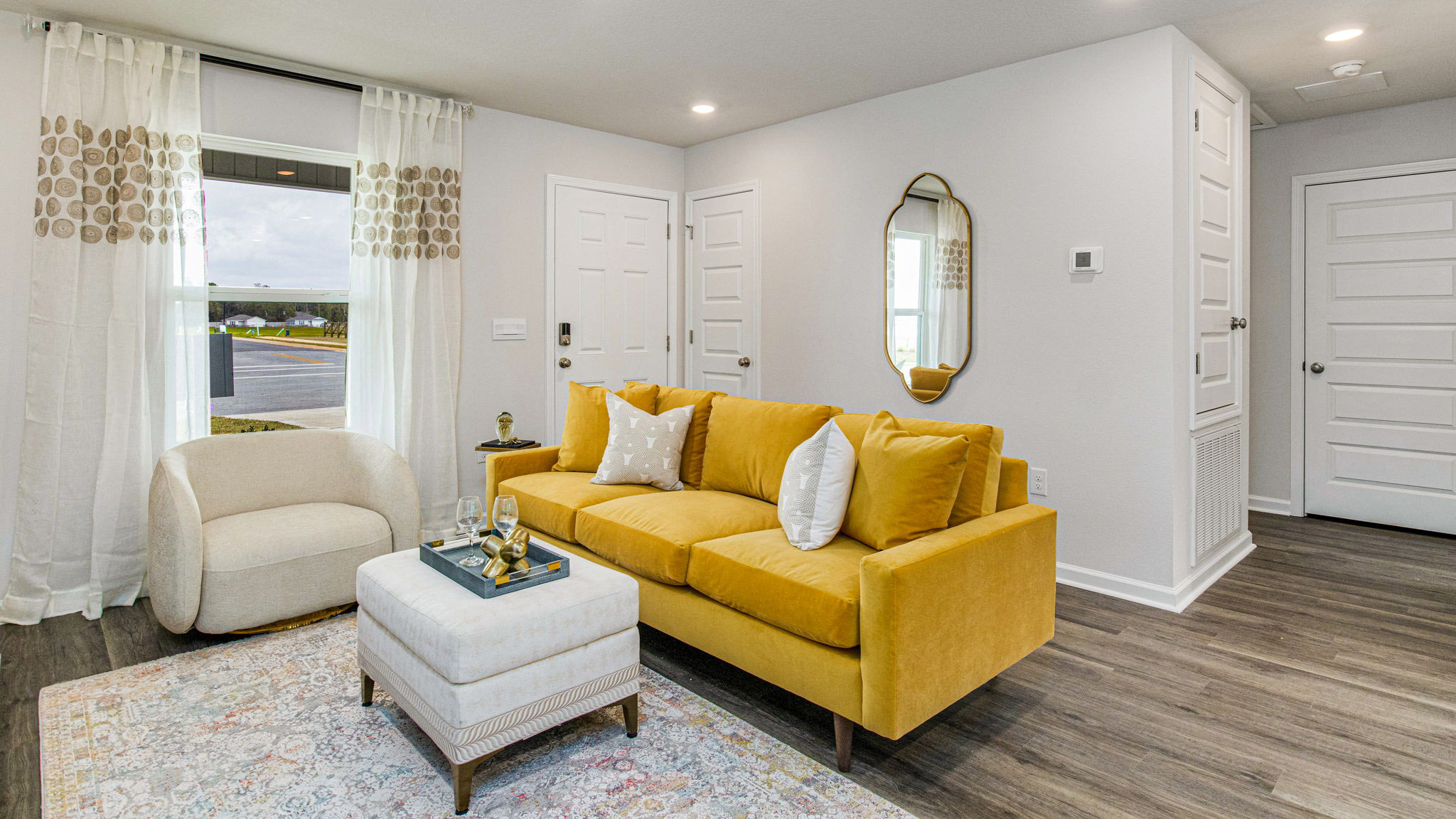 The Allanton floorplan living room with EVP flooring throughout