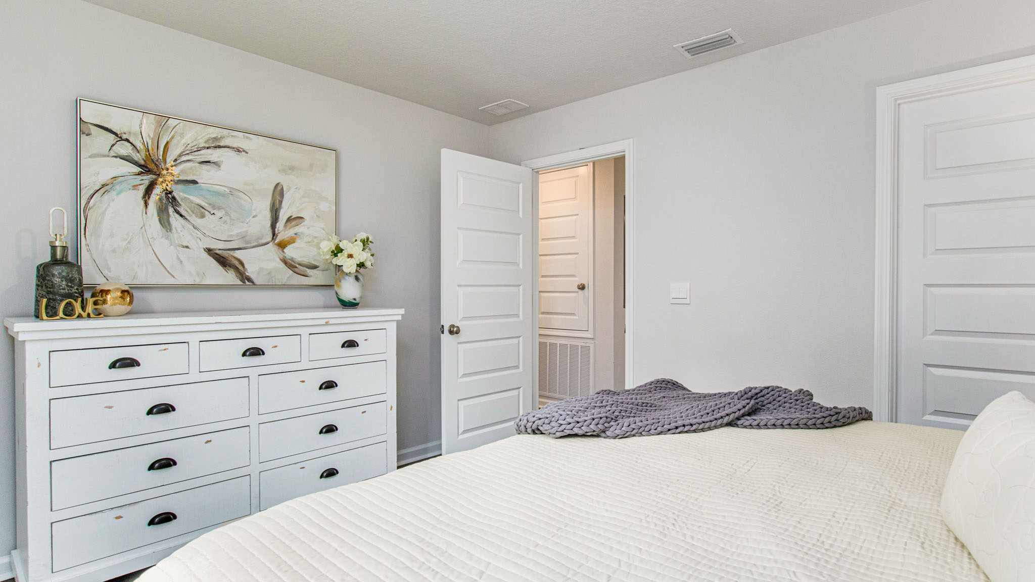 The Allanton floorplan primary bedroom with EVP flooring throughout