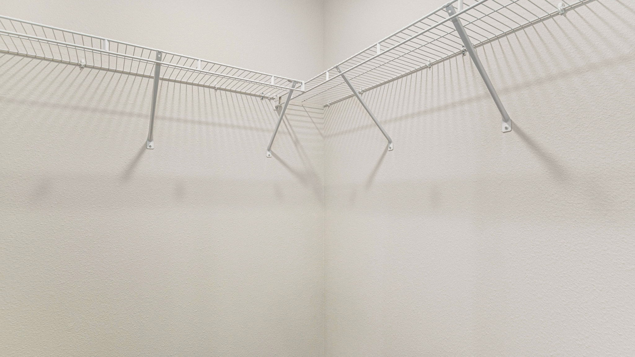 The Allanton floorplan primary closet with wire shelving