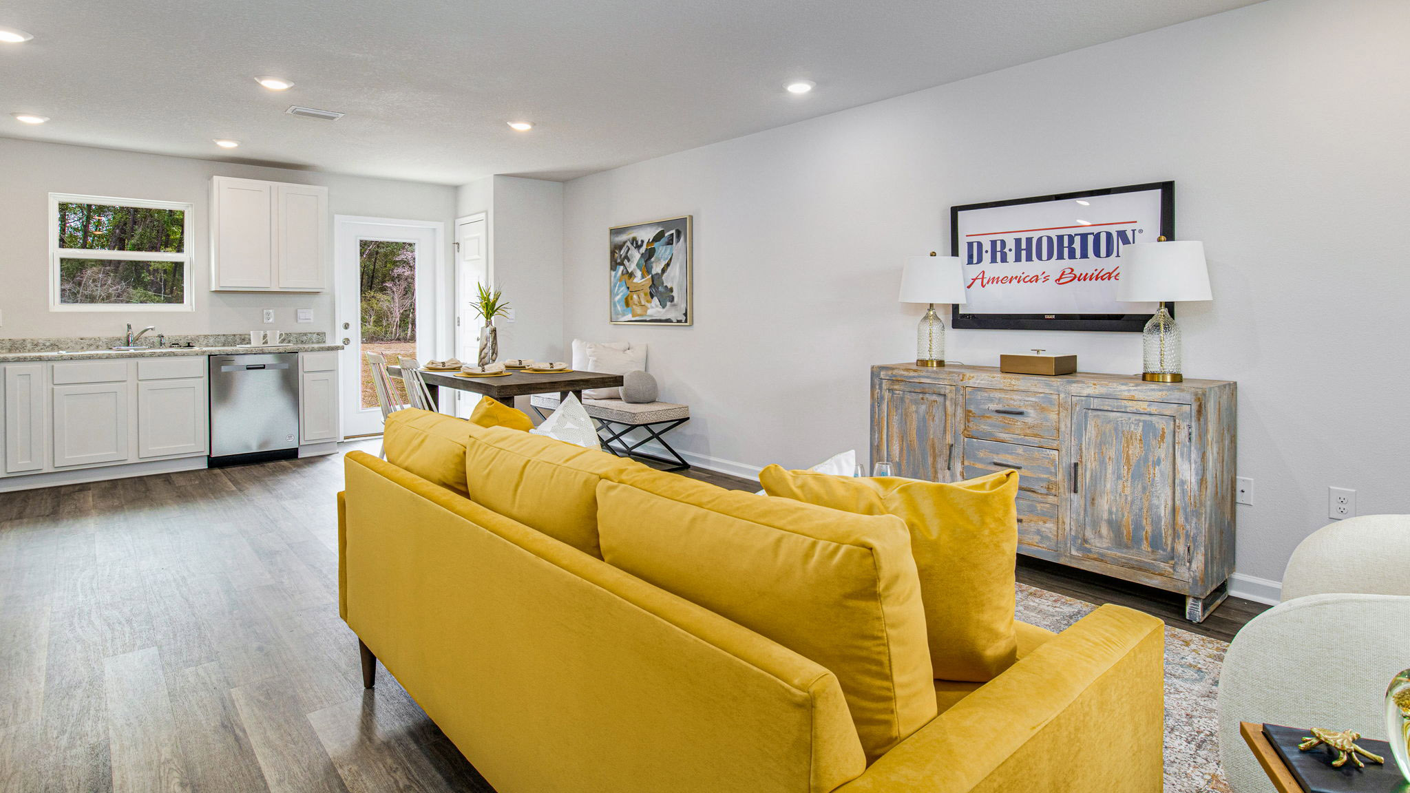 The Allanton floorplan living room with EVP flooring throughout