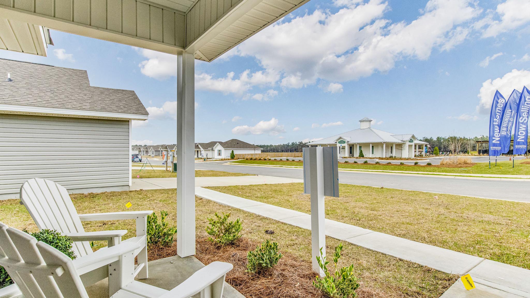 The Allanton model home front porch view of the club house