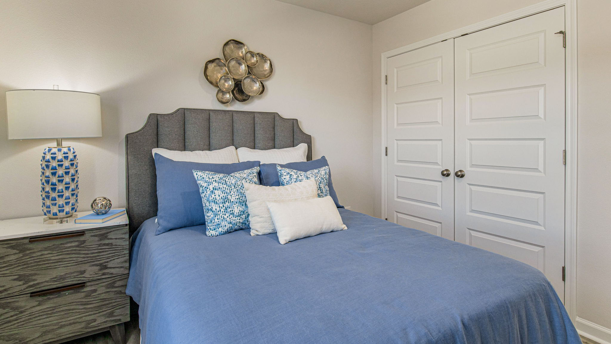 The Callaway floorplan guest bedroom one with EVP flooring throughout