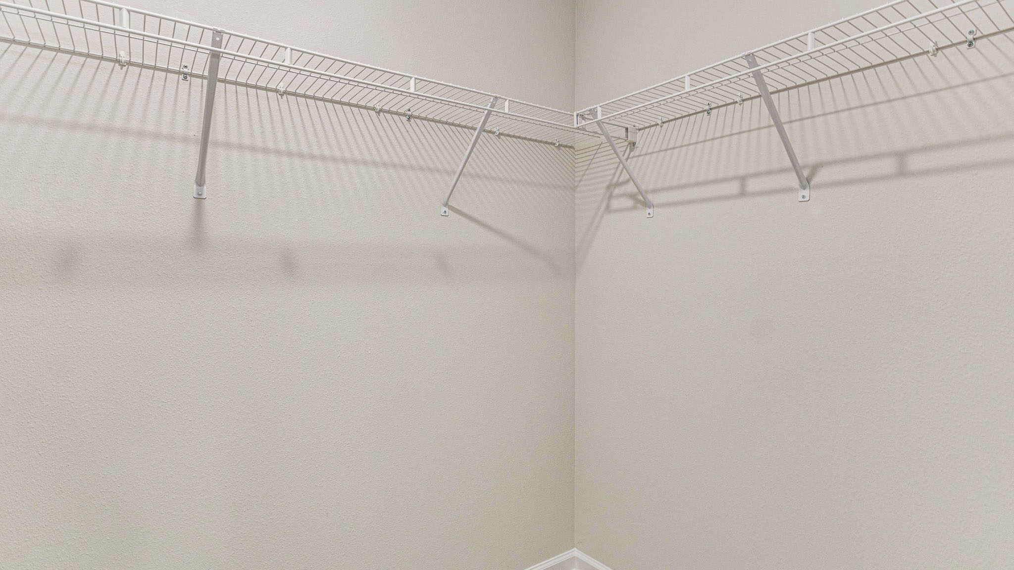 The Callaway floorplan primary bedroom closet with wire shelving