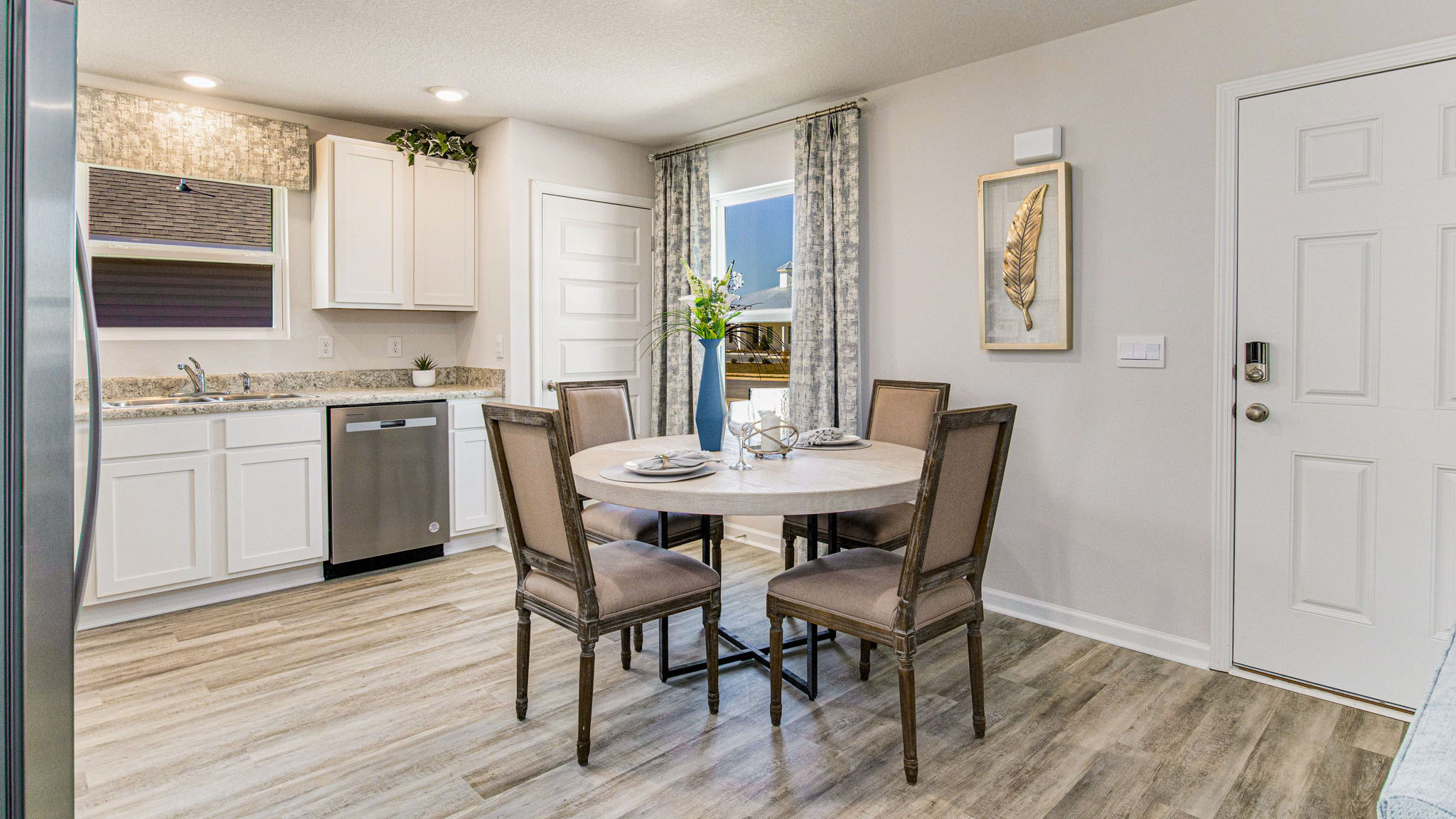 The Callaway floorplan kitchen and dining space with window view