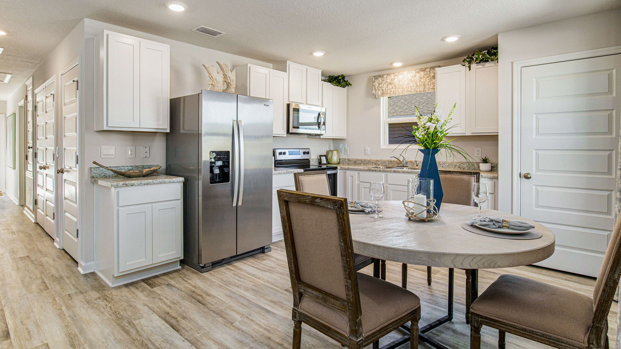 The Callaway floorplan kitchen with white shaker cabinets and Formica countertops