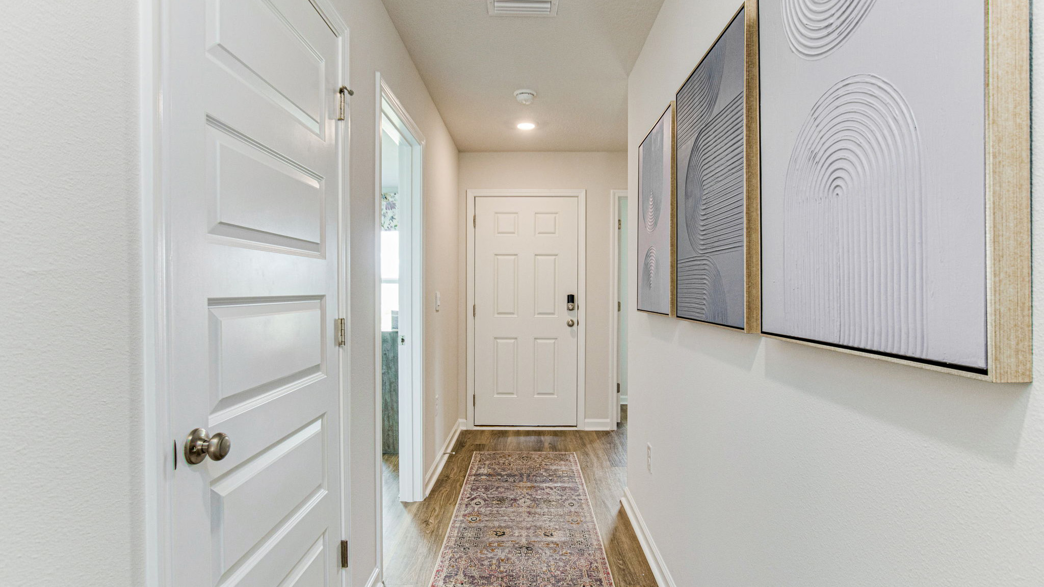 The Sullivan floorplan entry way with EVP flooring throughout