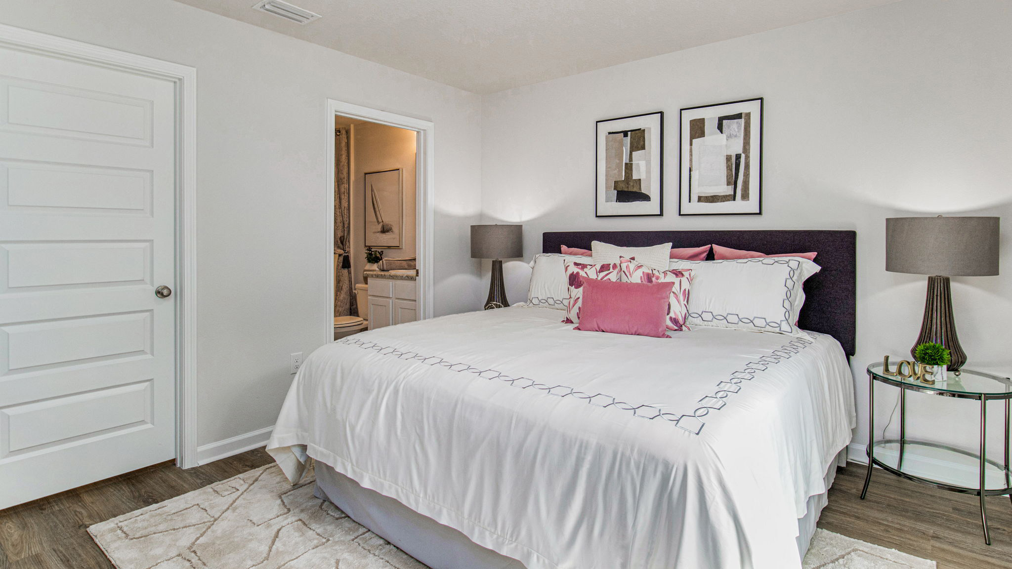 The Sullivan floorplan primary bedroom with EVP flooring throughout