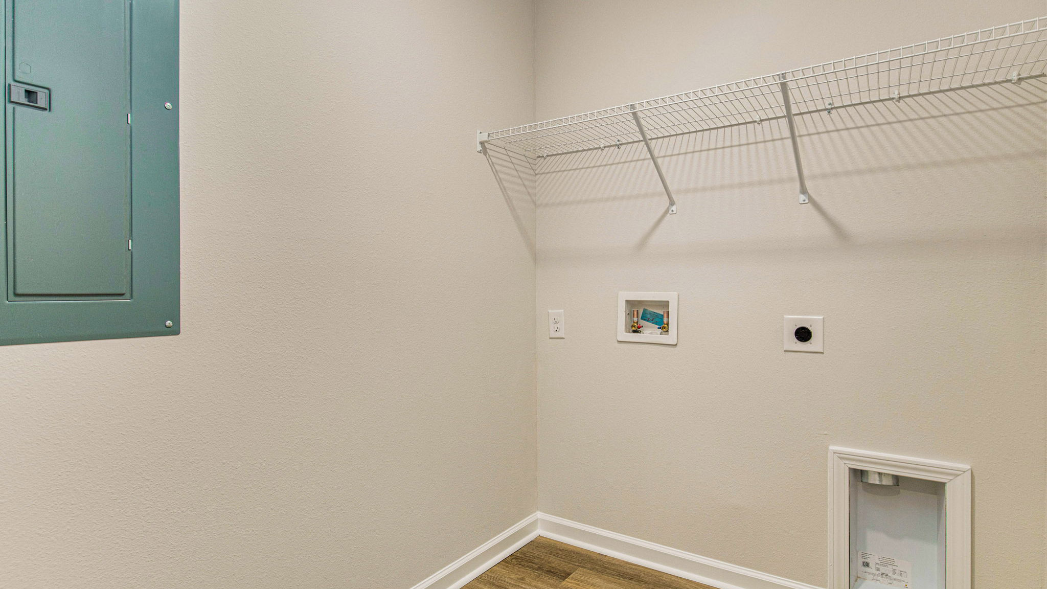 The Sullivan floorplan laundry room with EVP flooring throughout