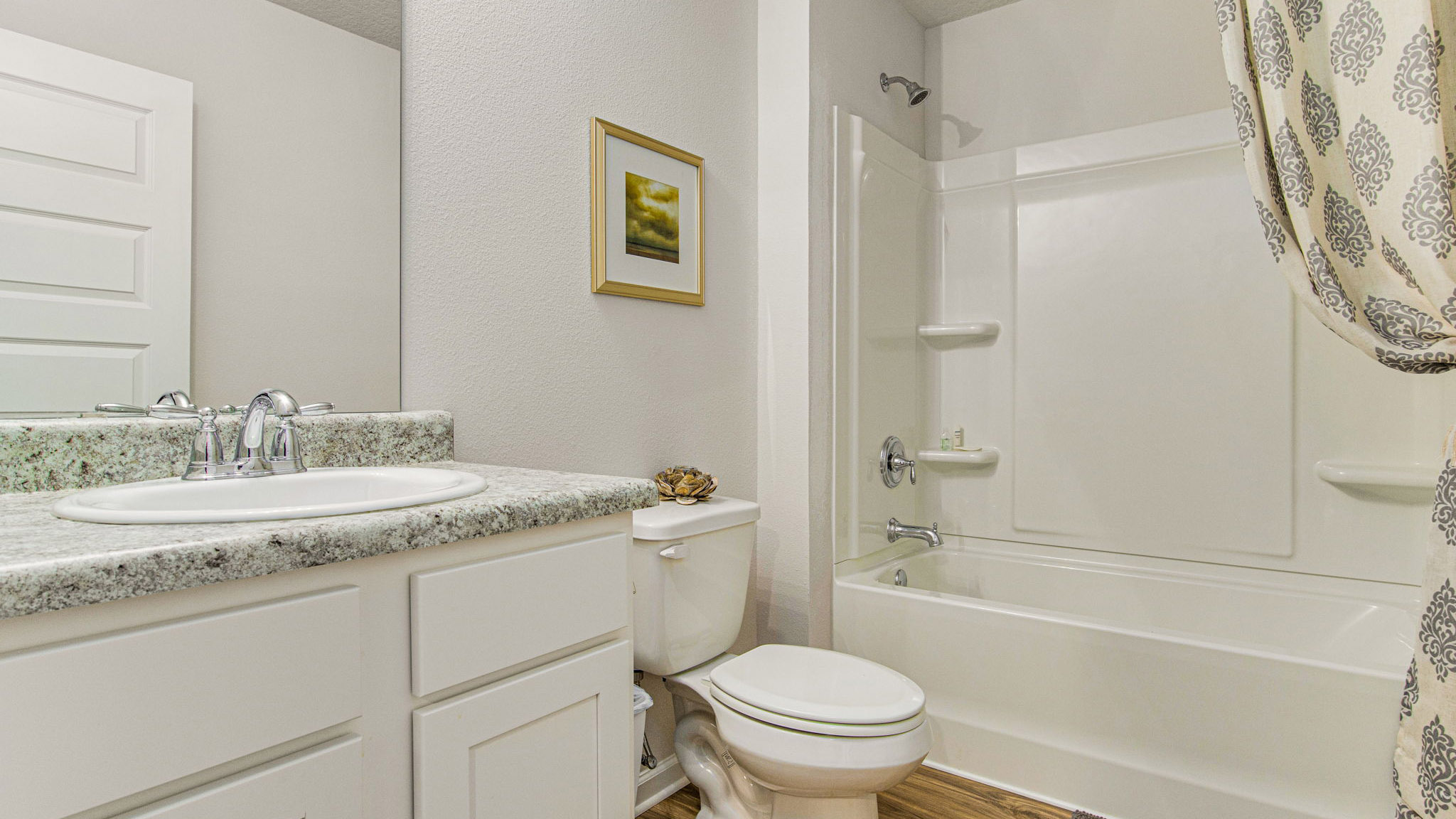 The Cali floorplan guest bathroom with shower and tub combo