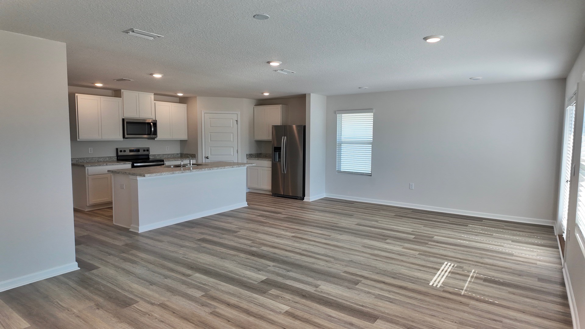 The Lismore floorplan open concept kitchen and living room