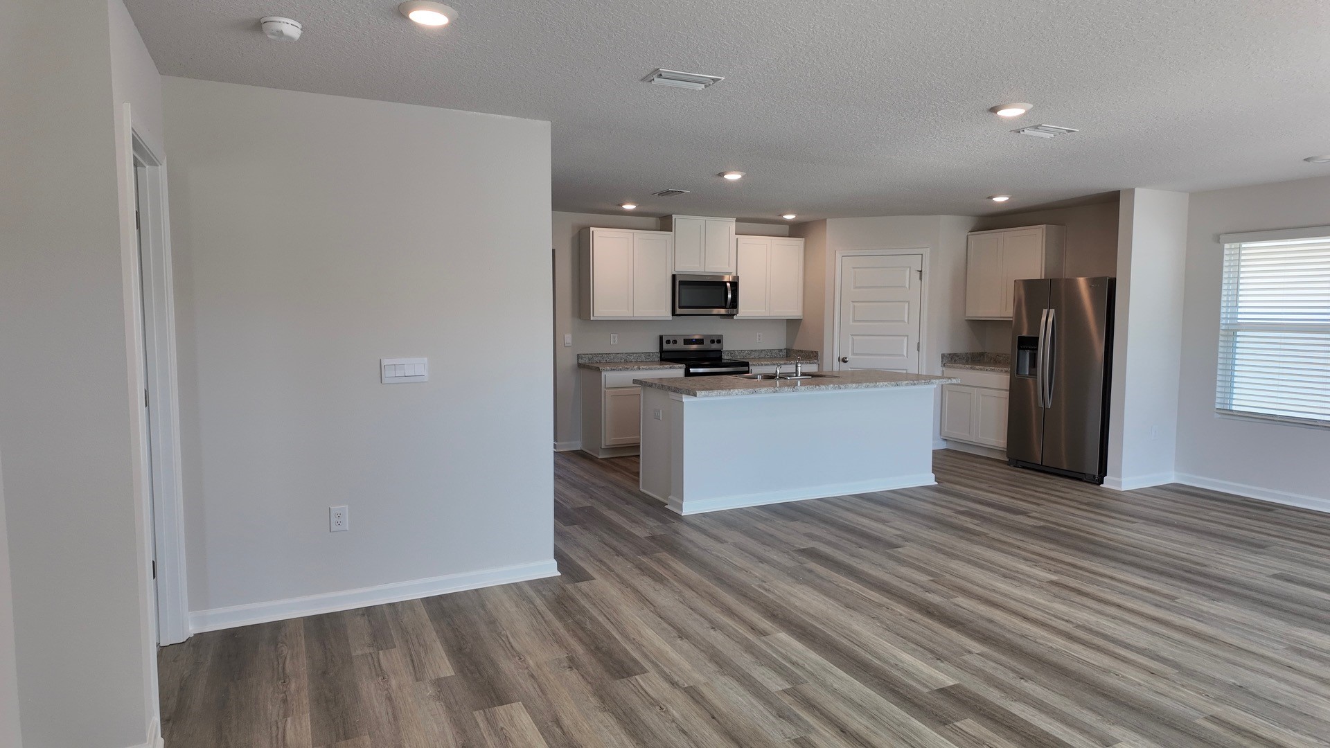 The Lismore floorplan open concept kitchen and living room