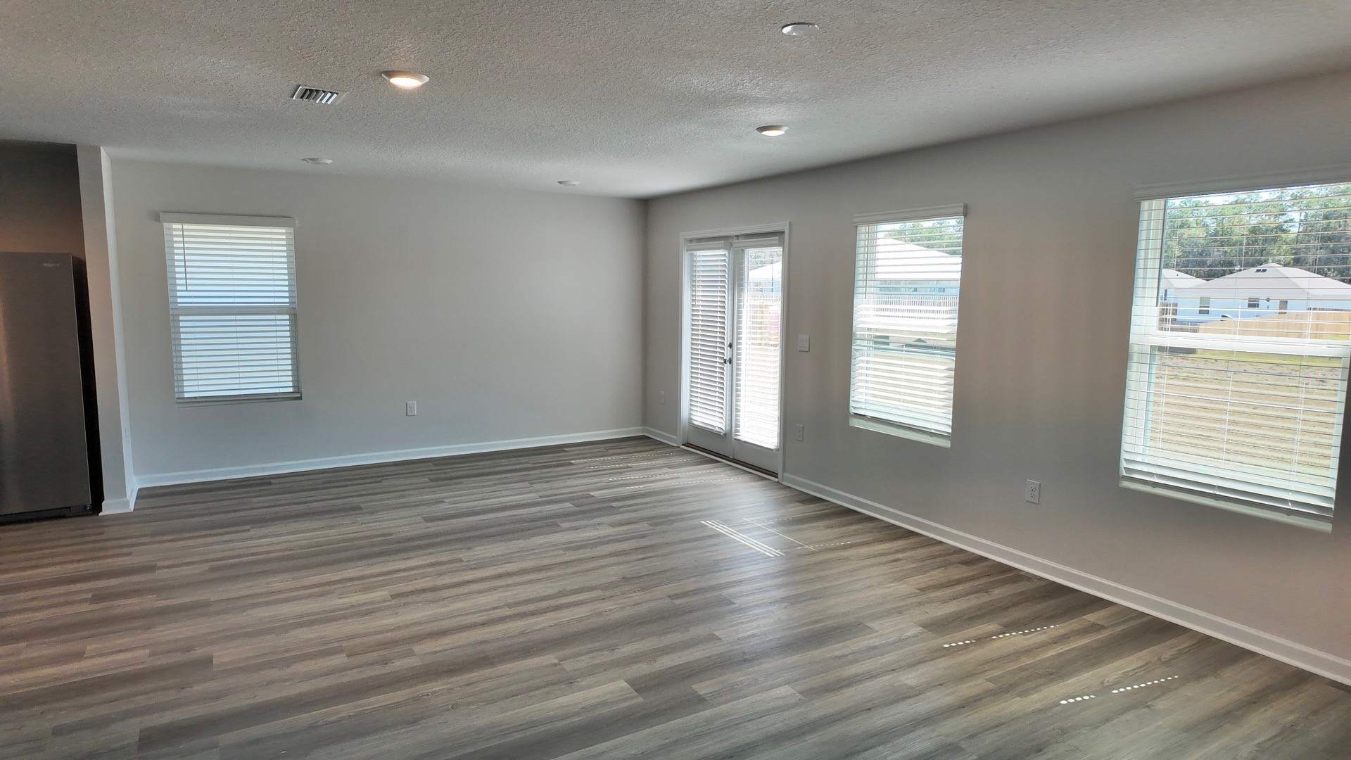 The Lismore floorplan living room with EVP flooring throughout
