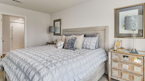 The Cali floorplan primary bedroom with carpet throughout