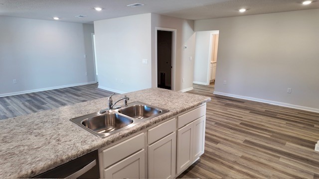 The Lakeside floorplan kitchen island with Formica countertops and stainless-steel appliances