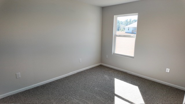 The Lakeside floorplan guest bedroom three with window view